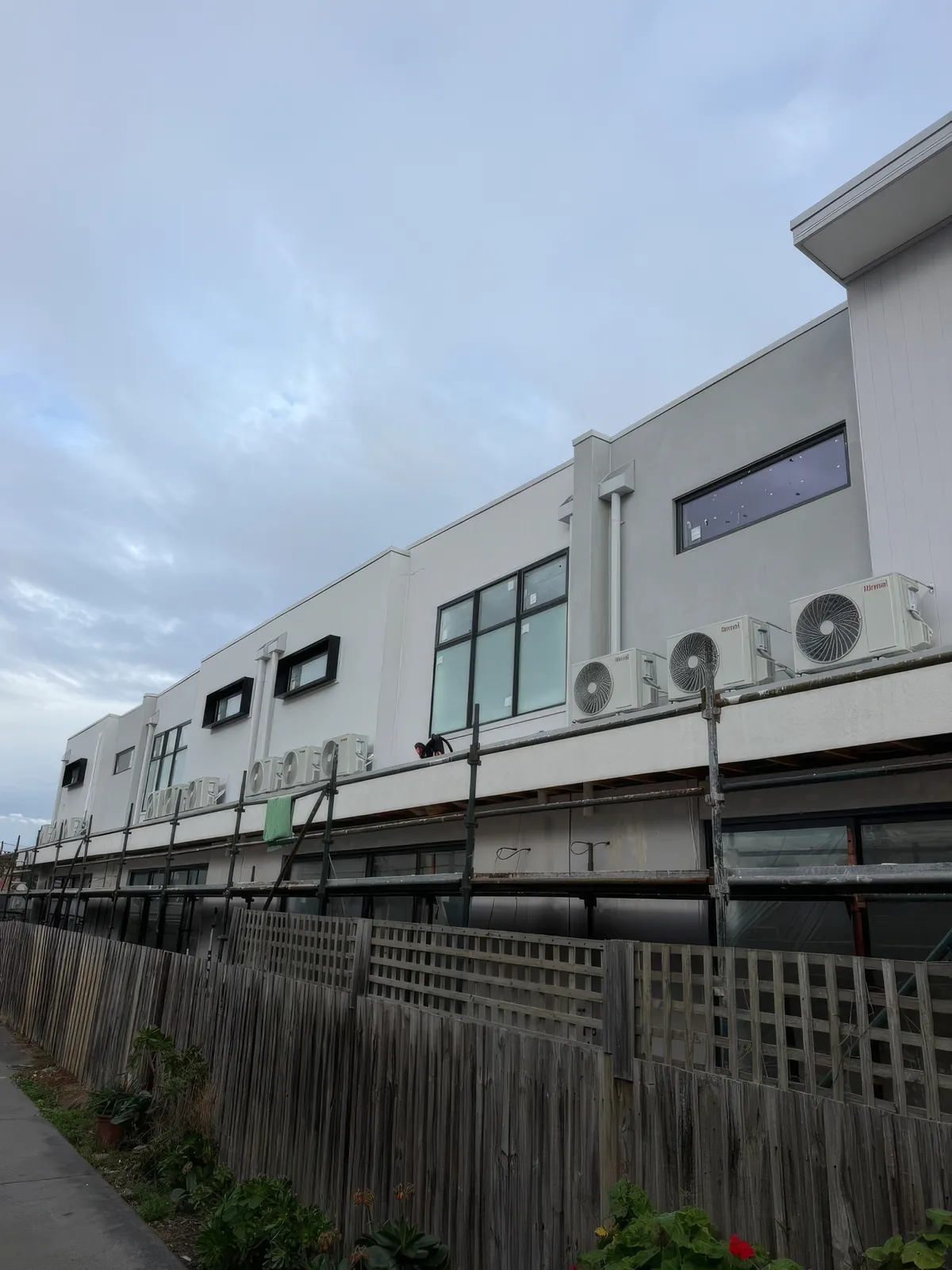 Condensers on the upper service ledge of the Brunswick commercial and retail building