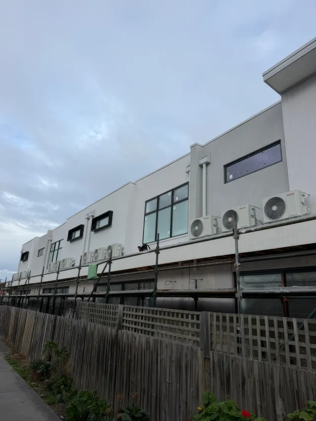 Condensers on the upper service ledge of the Brunswick commercial and retail building