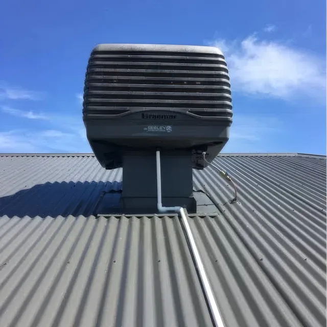 Evaporative cooling unit on a home roof