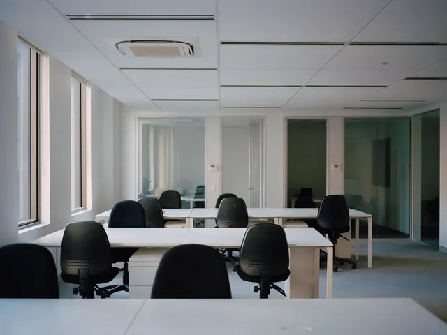Newly fitted open-plan office with slot diffusers and a ceiling cassette